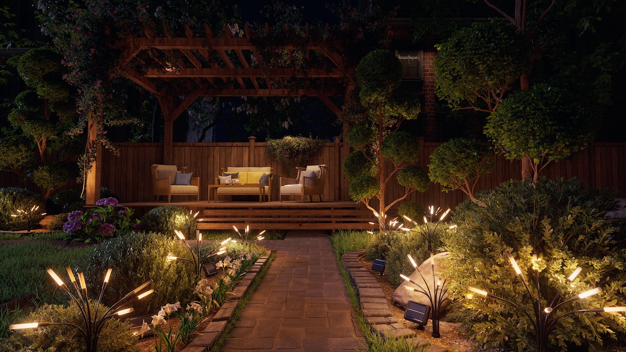 Widok z tarasu na Nanoleaf Solar Garden Lights rozmieszczone w ogrodzie